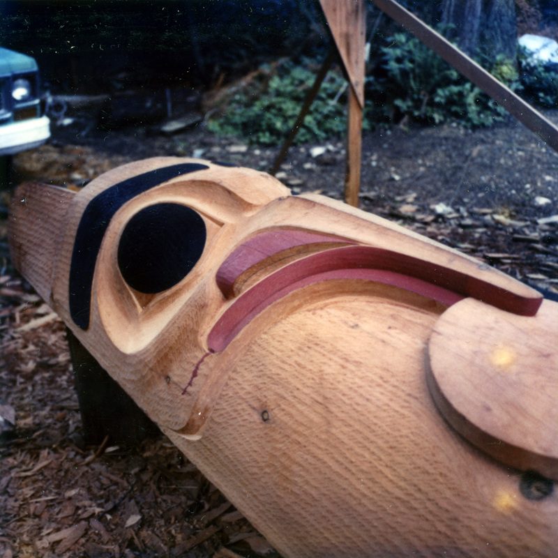 color photo of a partly painted totem pole