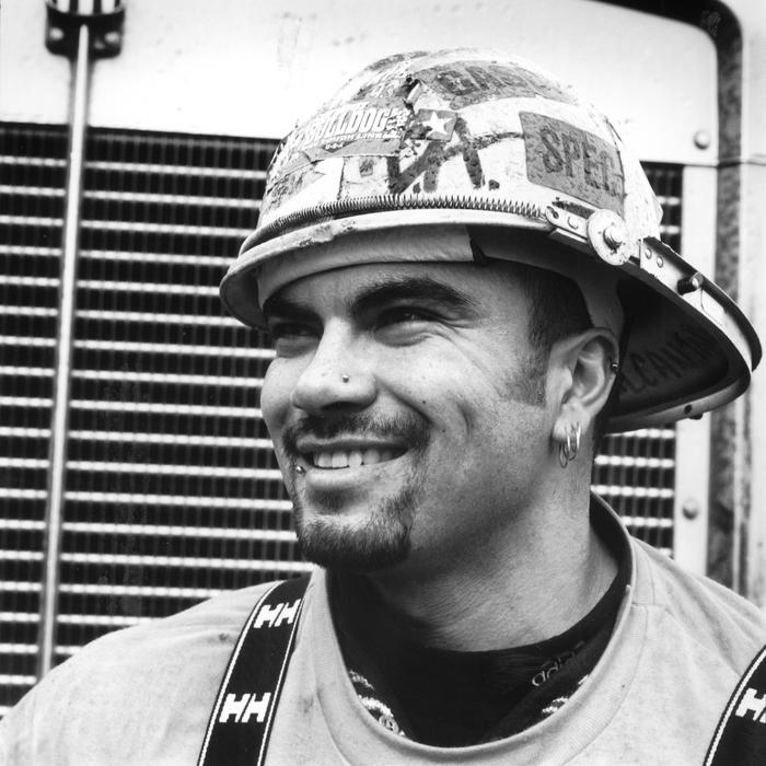 Smiling man wearing decorated hard hat