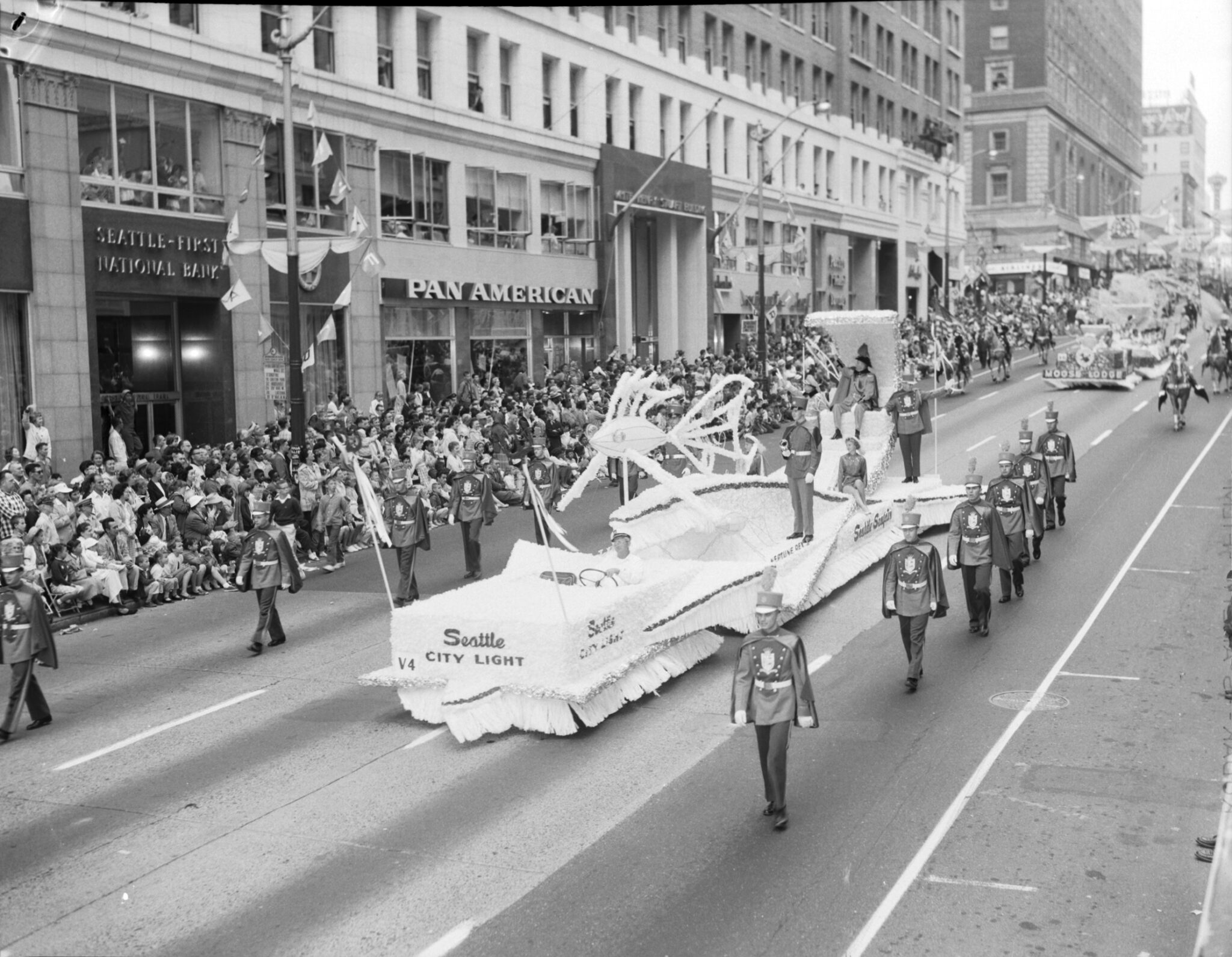 black and white photo of Seattle City Light float in 1959 Seafair parade