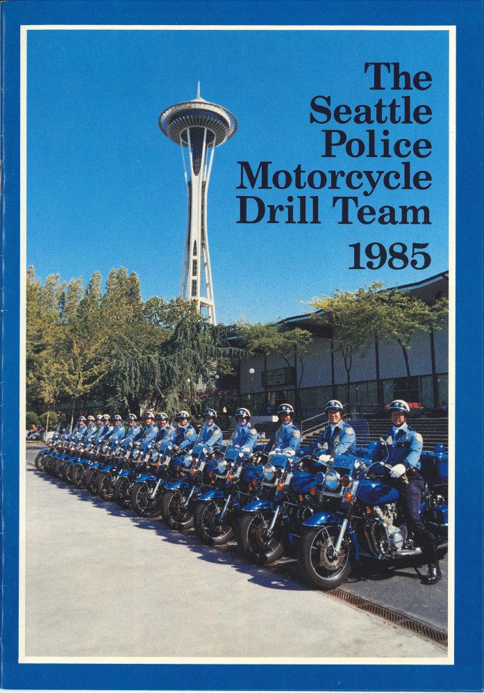 cover of motorcycle drill team booklet showing officers on motorcycles in front of Space Needle