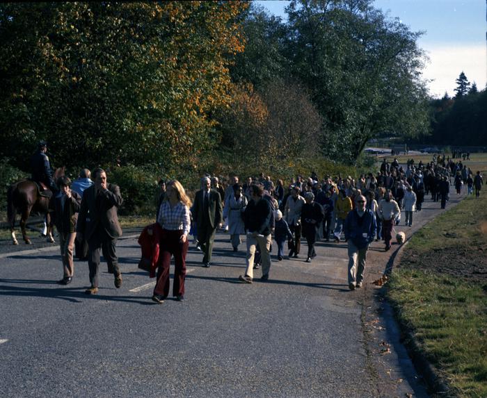 color photo showing group of people walking in Discovery Park, 1973