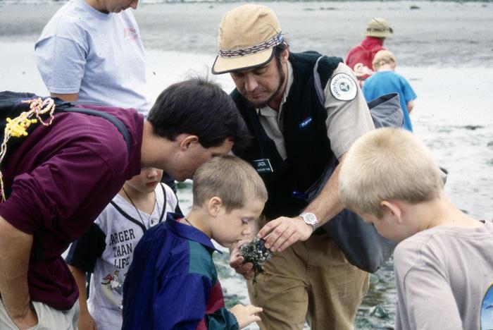 color photo of man teaching children in Discovery Park, circa 1990s